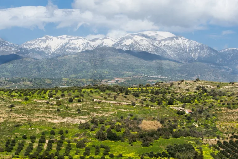 The test photograph for the PNG to WEBP comparison: a Cretan valley with snow on the mountains behind it.